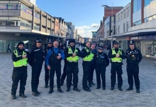 10 people in a row. a selection of police officers and the safety community team in Southend high street at Victoria Circus